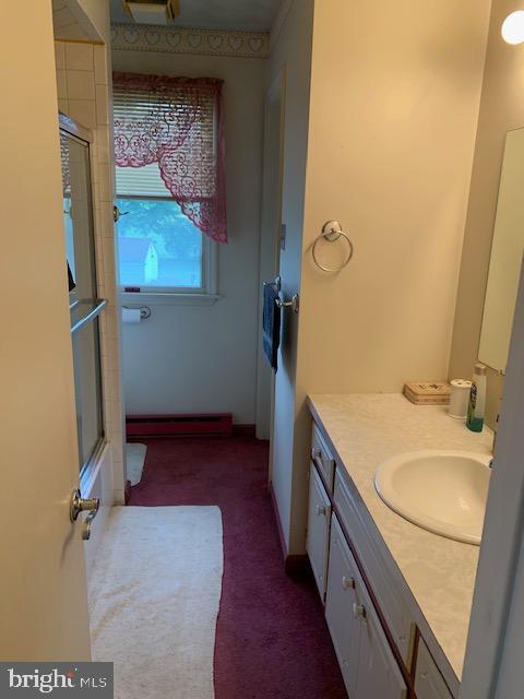 155 Farm Valley Road Wellsville, PA 17365 - Photo 21 of 31 a bathroom with a sink and mirror with toilet