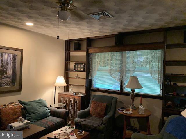 155 Farm Valley Road Wellsville, PA 17365 - Photo 10 of 31 a living room with furniture and a window