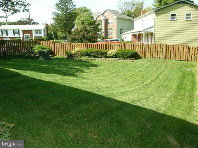 1204 Smith Village Road Silver Spring, MD 20904 - Photo 1 of 17 a view of a house with a yard and deck