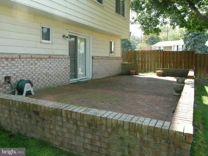 1204 Smith Village Road Silver Spring, MD 20904 - Photo 2 of 17 a view of backyard and wooden fence