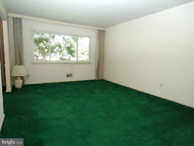 1204 Smith Village Road Silver Spring, MD 20904 - Photo 12 of 17 a view of an empty room with a window