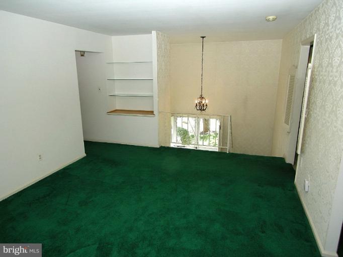 1204 Smith Village Road Silver Spring, MD 20904 - Photo 13 of 17 a view of an empty room with kitchen and window