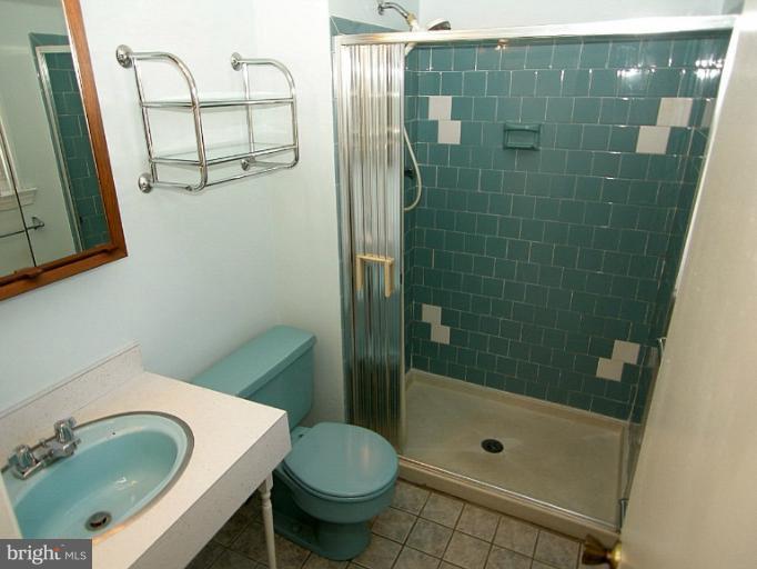 1204 Smith Village Road Silver Spring, MD 20904 - Photo 15 of 17 a bathroom with a sink and a mirror