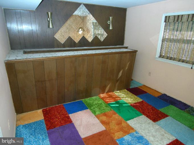 1204 Smith Village Road Silver Spring, MD 20904 - Photo 17 of 17 a room with toys and wooden floor