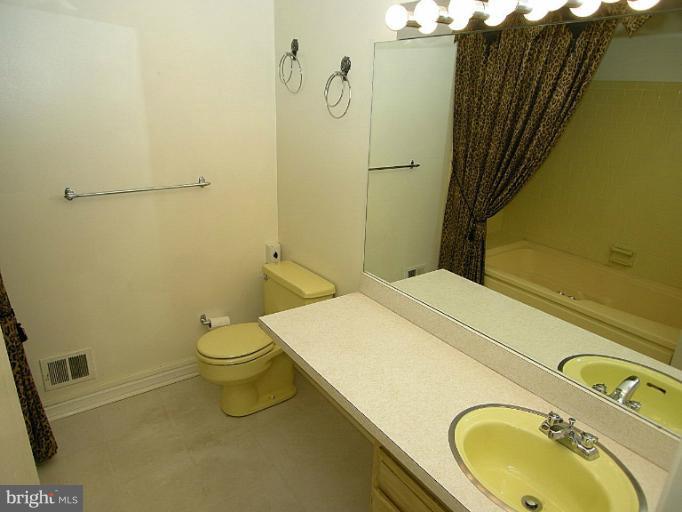1204 Smith Village Road Silver Spring, MD 20904 - Photo 8 of 17 a bathroom with a sink and toilet