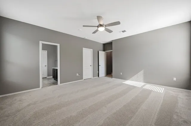 a bathroom with a granite countertop double vanity sink a vanity and mirror