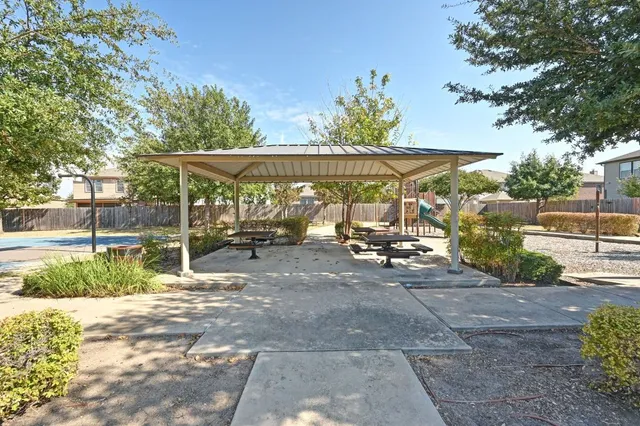 a view of a backyard with sitting area