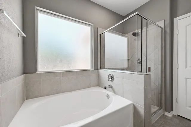 a front view of a building with a garden