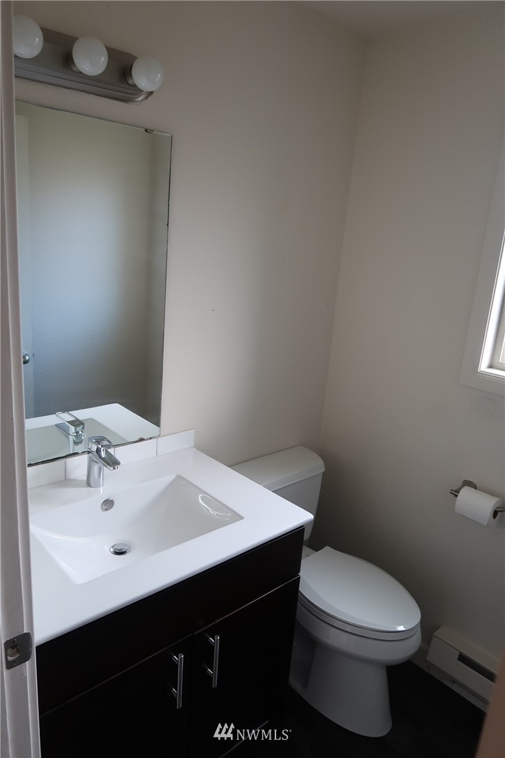 6515 Cady Road Everett, WA 98203 - Photo 11 of 15 a bathroom with a sink mirror and toilet