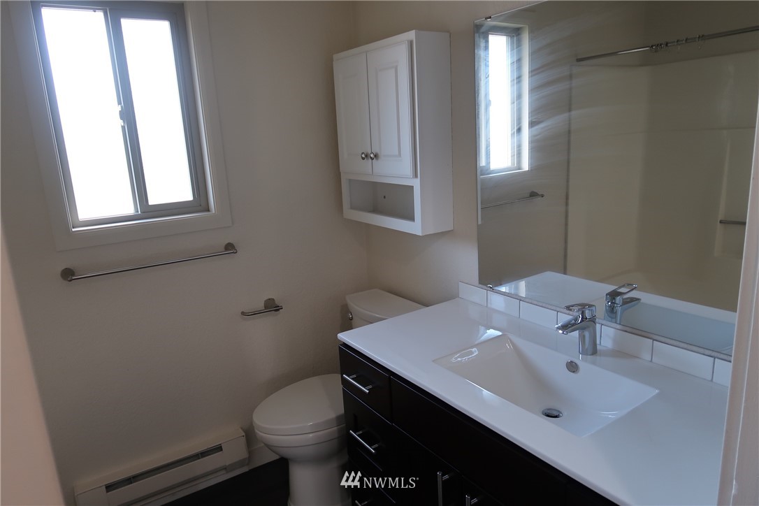 6515 Cady Road Everett, WA 98203 - Photo 12 of 15 a bathroom with a sink toilet and mirror