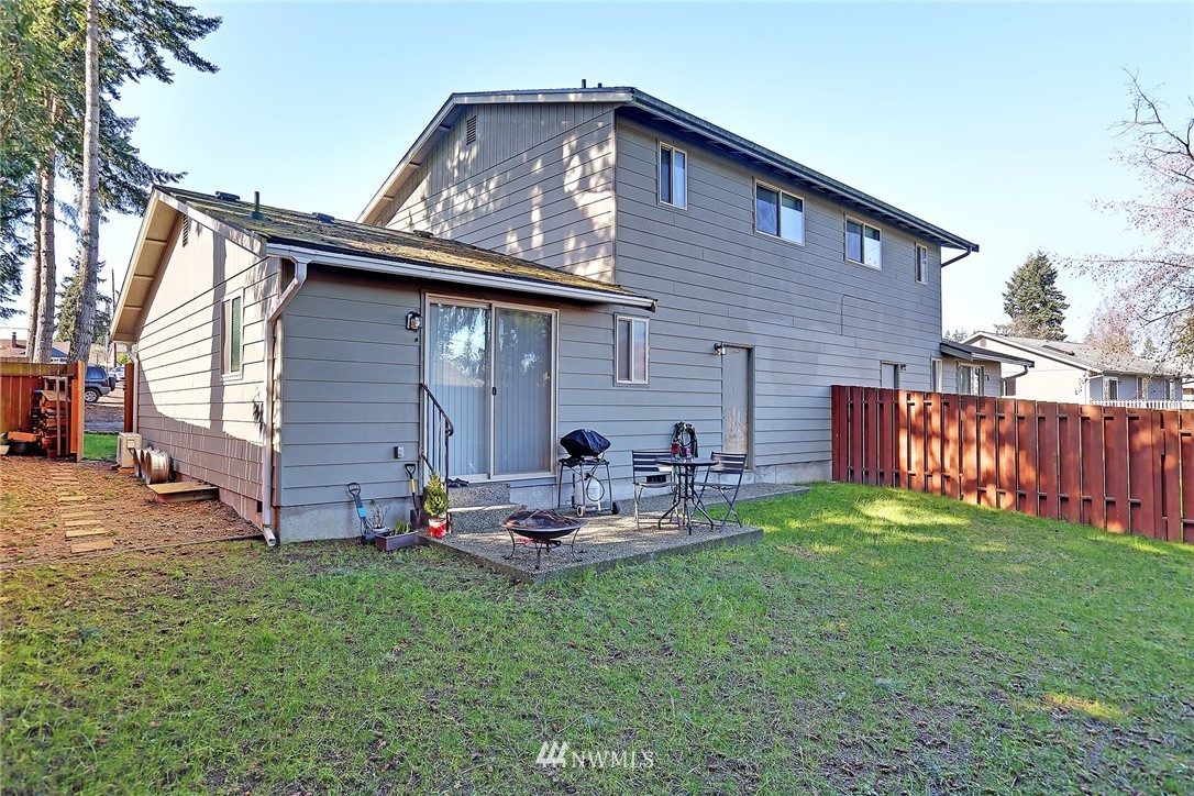 6515 Cady Road Everett, WA 98203 - Photo 4 of 15 a backyard of a house with table and chairs