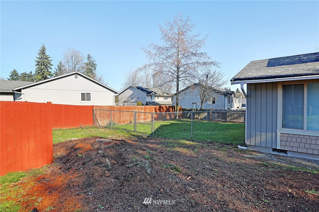 6515 Cady Road Everett, WA 98203 - Photo 5 of 15 a view of a house with a yard and wooden fence