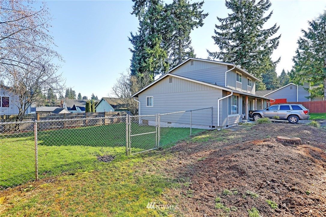 6515 Cady Road Everett, WA 98203 - Photo 6 of 15 a view of a house with a yard and a large tree