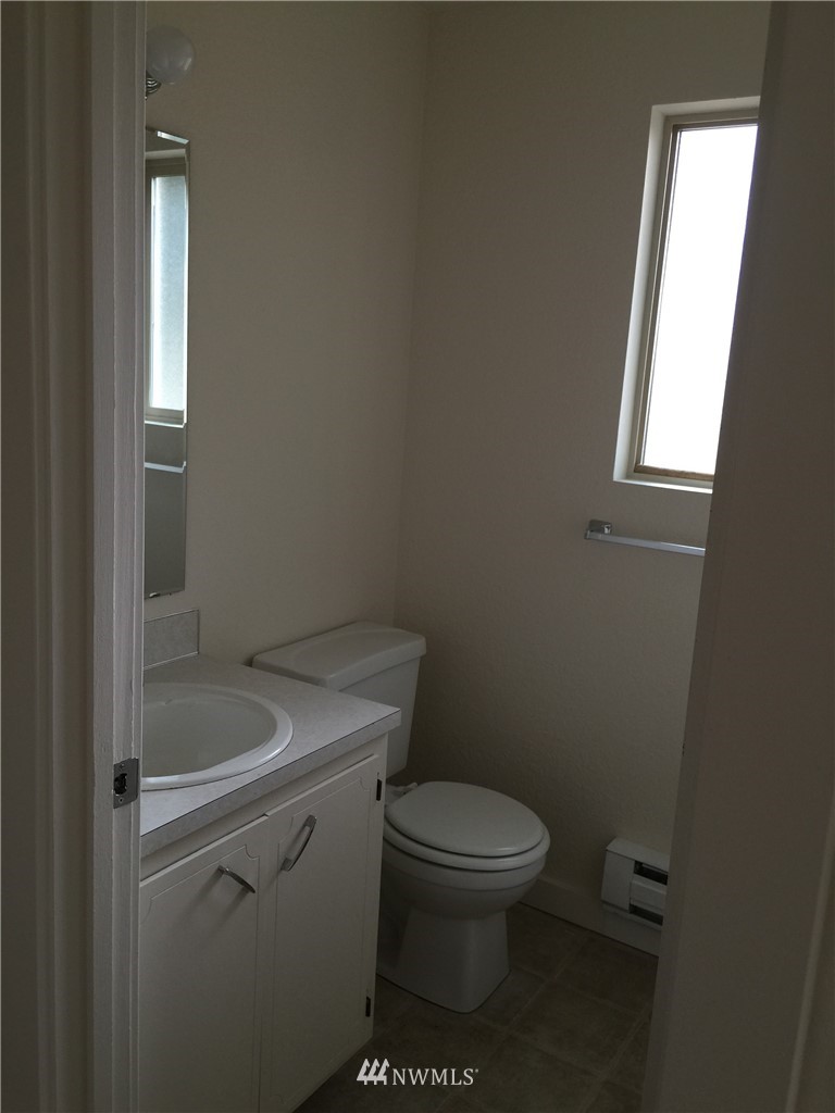 6515 Cady Road Everett, WA 98203 - Photo 8 of 15 a white toilet sitting next to a bathroom sink