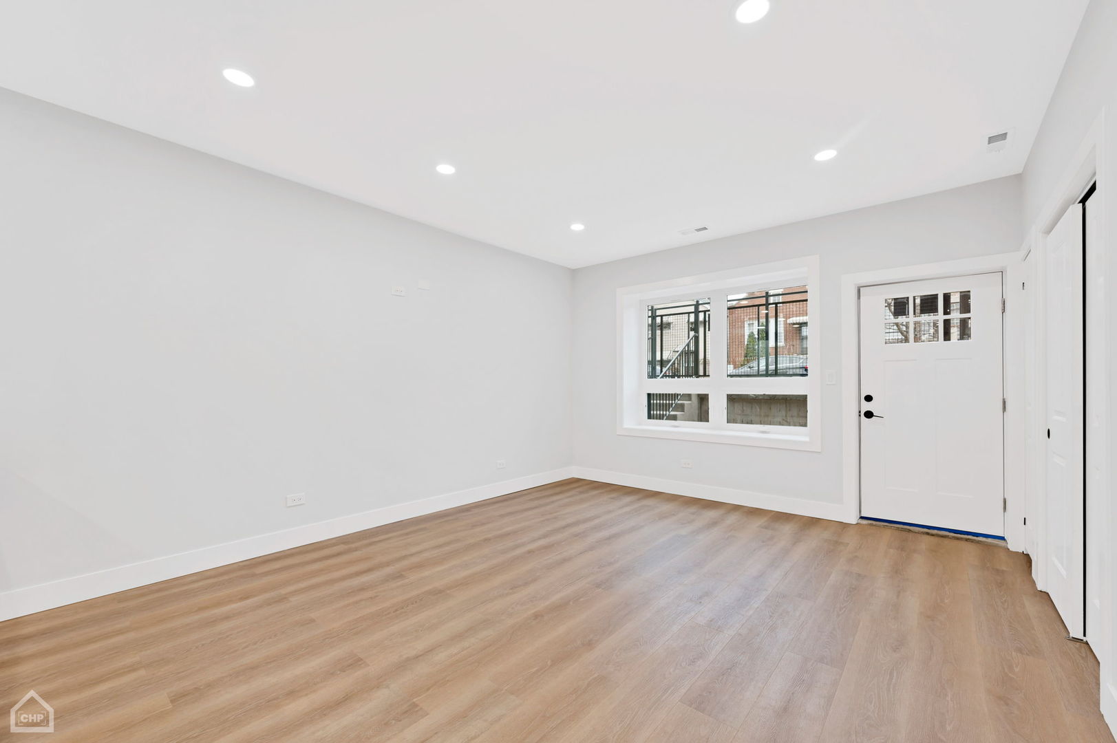 2132 South Fairfield Avenue, Unit 1 Chicago, IL 60608 - Photo 3 of 7 a view of wooden floor and windows in a room