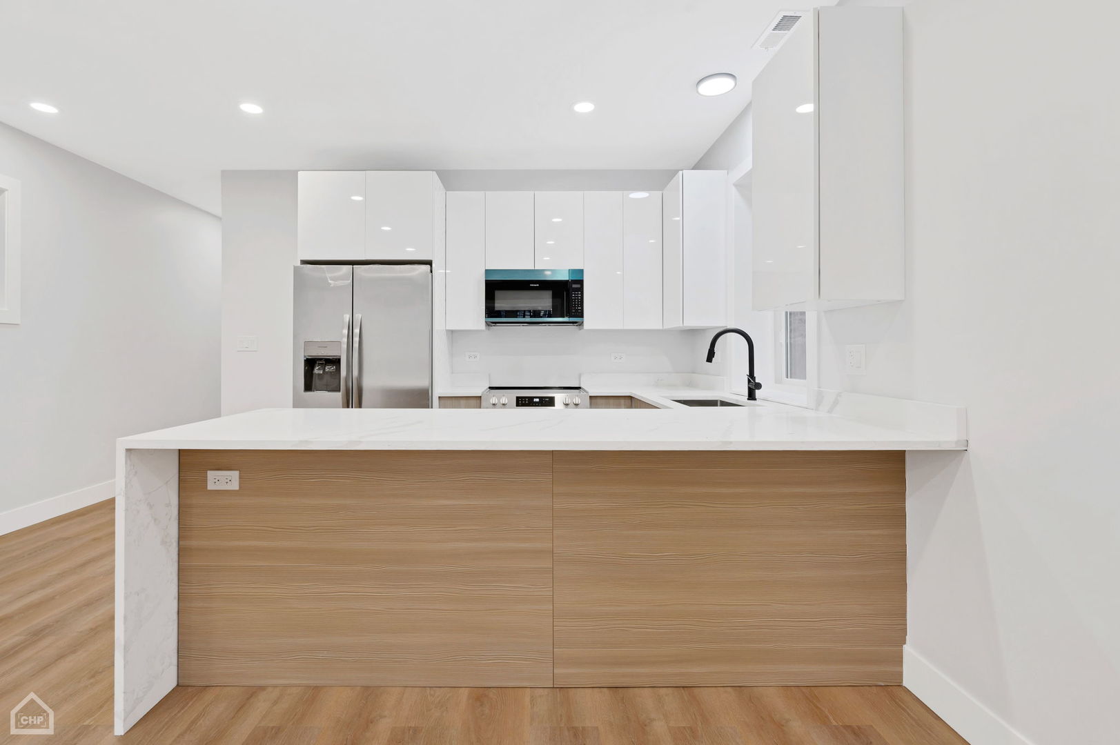 2132 South Fairfield Avenue, Unit 1 Chicago, IL 60608 - Photo 5 of 7 a bathroom with a sink a large mirror and a shower