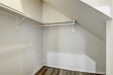 a view of kitchen with kitchen island wooden floor and center island