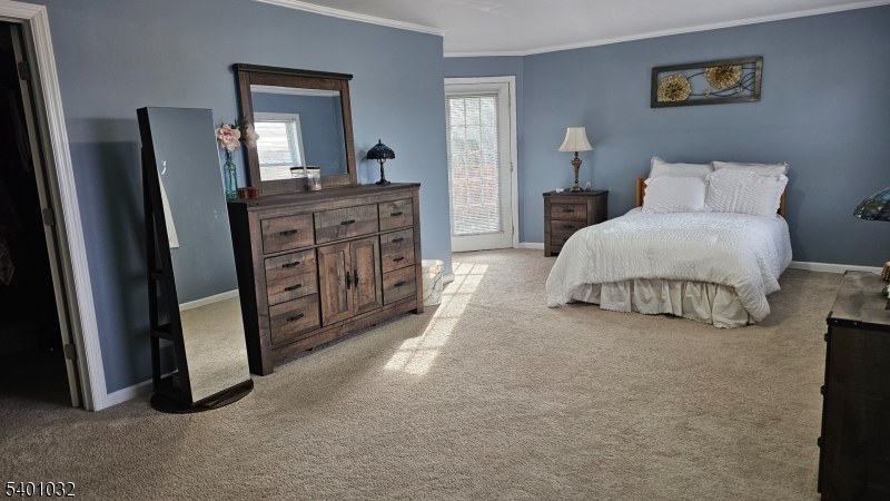 12 Ford Road Landing, NJ 07850 - Photo 16 of 32 a spacious bedroom with a bed and a dresser