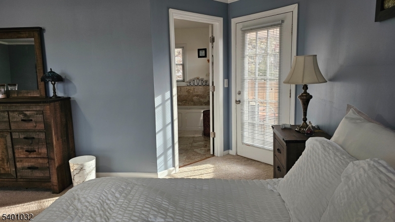 12 Ford Road Landing, NJ 07850 - Photo 18 of 32 a bedroom with a bed and wooden floor