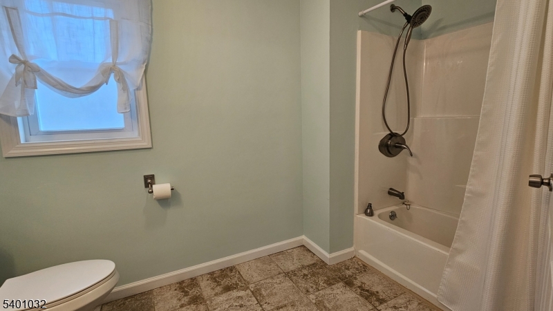 12 Ford Road Landing, NJ 07850 - Photo 24 of 32 a bathroom with a granite countertop bathtub shower and toilet