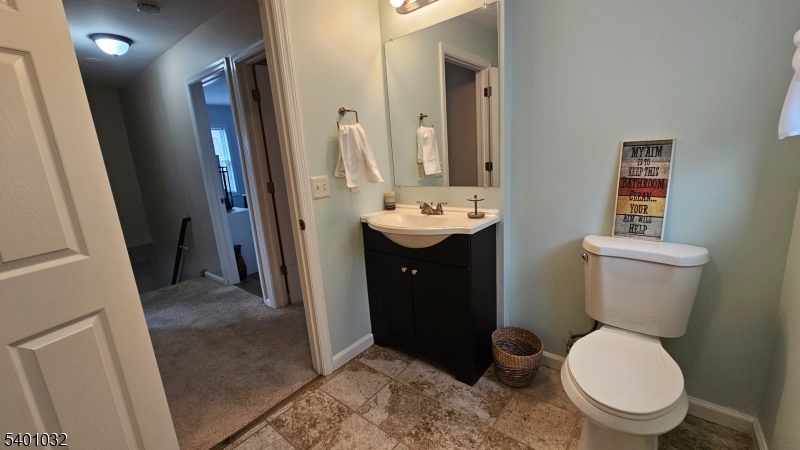12 Ford Road Landing, NJ 07850 - Photo 25 of 32 a bathroom with a toilet a sink and a mirror