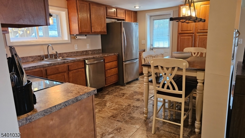 12 Ford Road Landing, NJ 07850 - Photo 5 of 32 a kitchen with a refrigerator and a sink