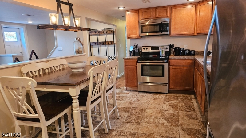 12 Ford Road Landing, NJ 07850 - Photo 7 of 32 a kitchen with a stove and a microwave