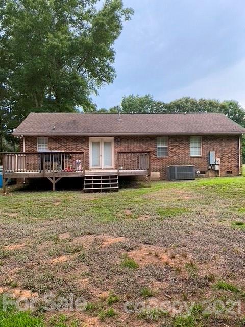 409 Chaney Road Monroe, NC 28110 - Photo 2 of 23 a front view of a house with a yard