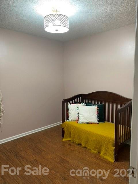 409 Chaney Road Monroe, NC 28110 - Photo 11 of 23 a bedroom with a bed and a night stand