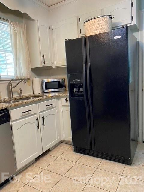 409 Chaney Road Monroe, NC 28110 - Photo 19 of 23 a kitchen with stainless steel appliances granite countertop a refrigerator and a sink