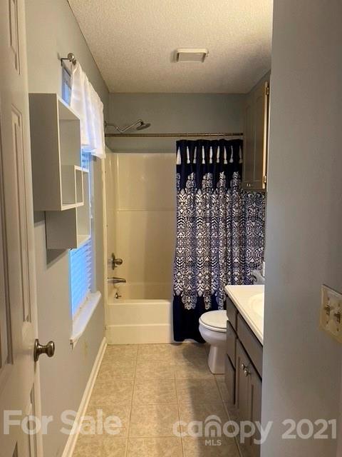 409 Chaney Road Monroe, NC 28110 - Photo 3 of 23 a bathroom with a toilet sink and shower