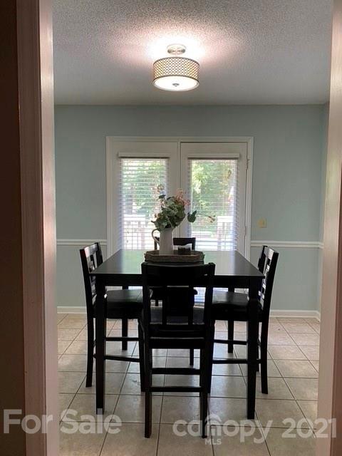 409 Chaney Road Monroe, NC 28110 - Photo 21 of 23 a view of a dining room with furniture and window