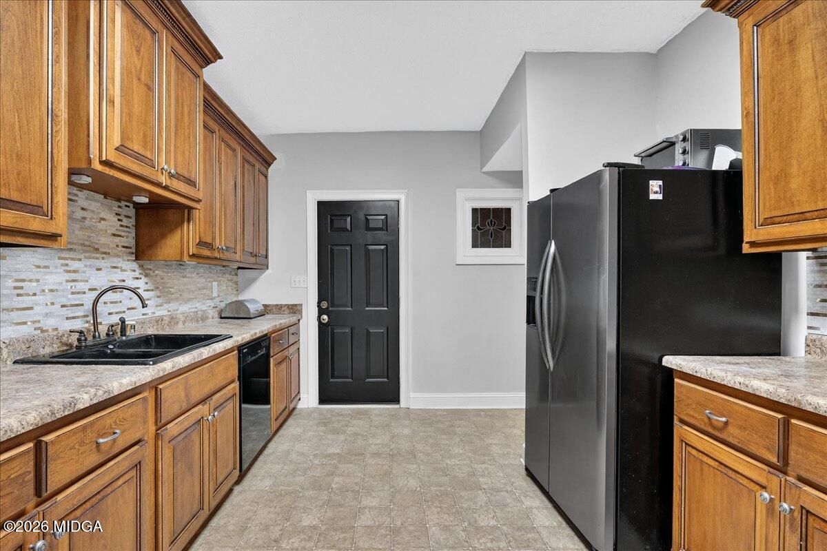 518 River Overlook Forsyth, GA 31029 - Photo 49 of 96 a kitchen with stainless steel appliances granite countertop a refrigerator a stove and a sink