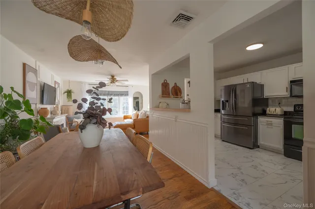 a view of a kitchen and dining room