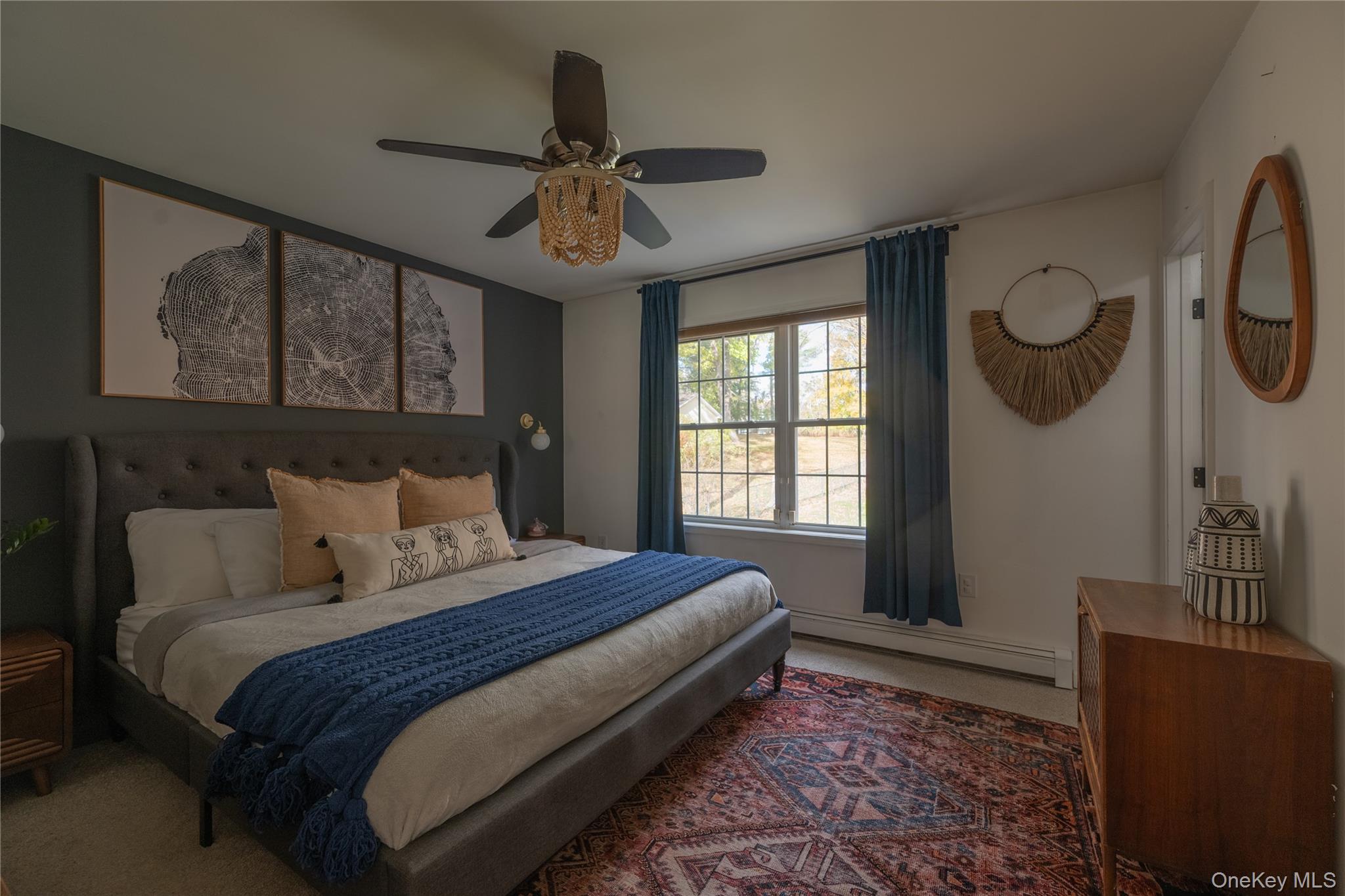 13 Hamilton Road Pine Bush, NY 12566 - Photo 31 of 46 a bedroom with a large bed and a chandelier