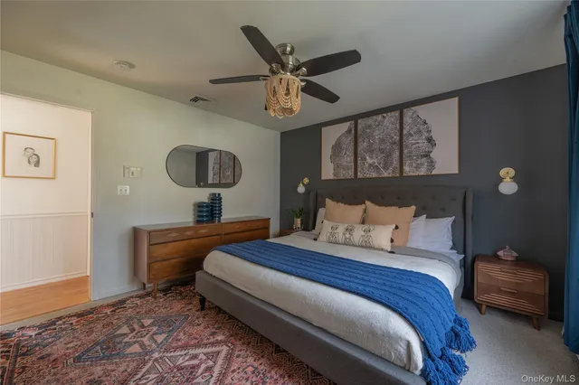 a bedroom with a bed and window