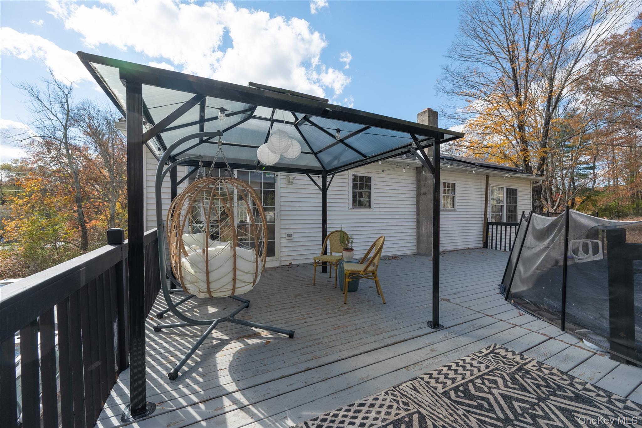 13 Hamilton Road Pine Bush, NY 12566 - Photo 43 of 46 a view of a patio with table and chairs under an umbrella