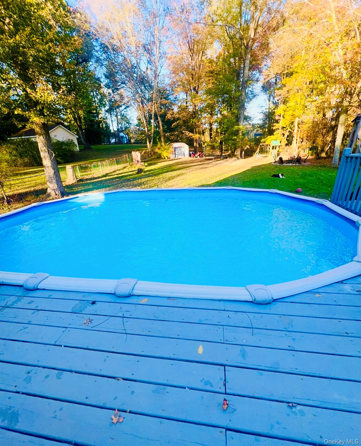 13 Hamilton Road Pine Bush, NY 12566 - Photo 45 of 46 a view of a swimming pool with an outdoor space and seating area