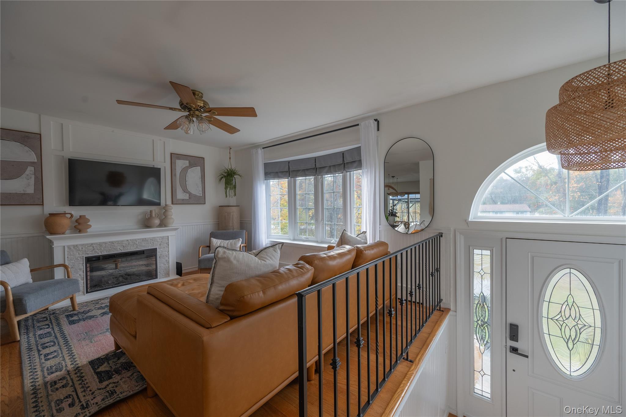 13 Hamilton Road Pine Bush, NY 12566 - Photo 10 of 46 a living room with furniture a fireplace and a flat screen tv
