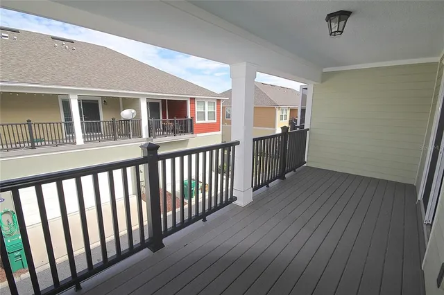 a view of a porch with wooden floor