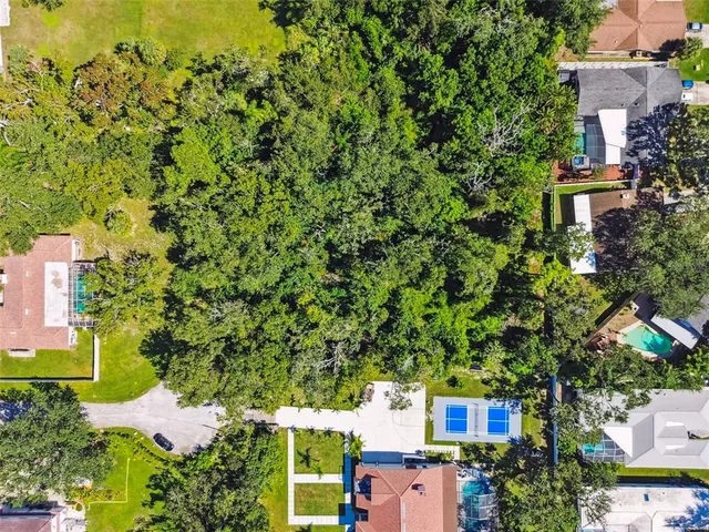 an aerial view of houses with yard