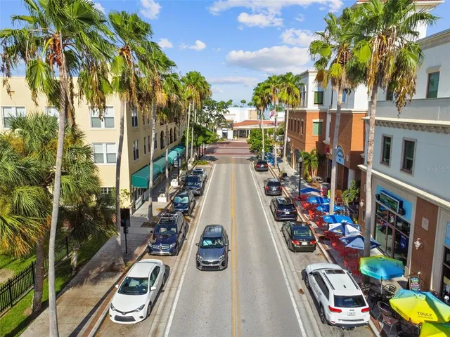 a view of a street with benches