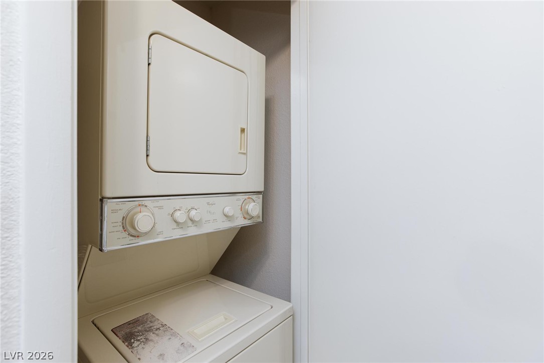 5171 South Lindell Road, Unit 103 Las Vegas, NV 89118 - Photo 11 of 24 A convenient stacked washer and dryer unit, ideal for efficient use of space.