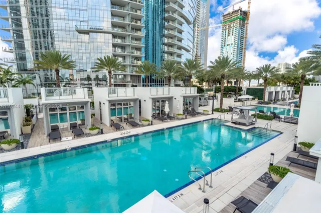 a view of a swimming pool with chairs