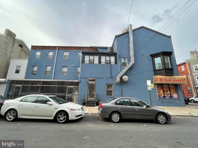 a view of a car parked in front of a house