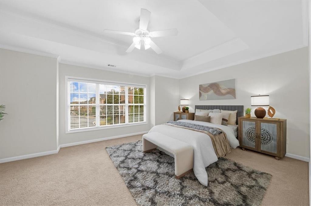 2426 Strand Avenue Lawrenceville, GA 30043 - Photo 11 of 30 a bedroom with a large bed and a window