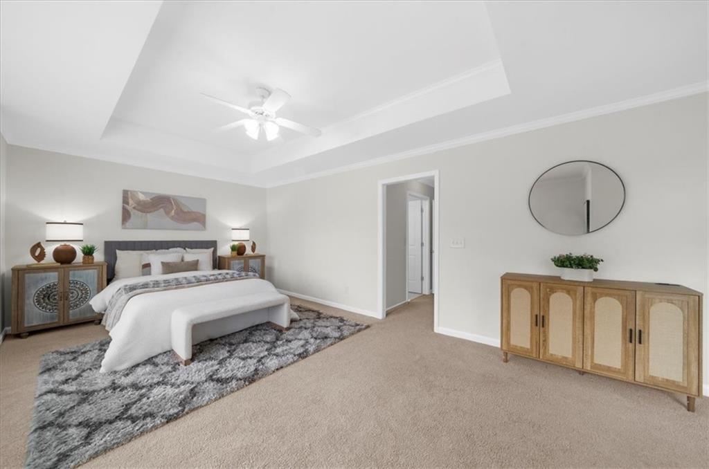 2426 Strand Avenue Lawrenceville, GA 30043 - Photo 14 of 30 a bedroom with bed and a chandelier