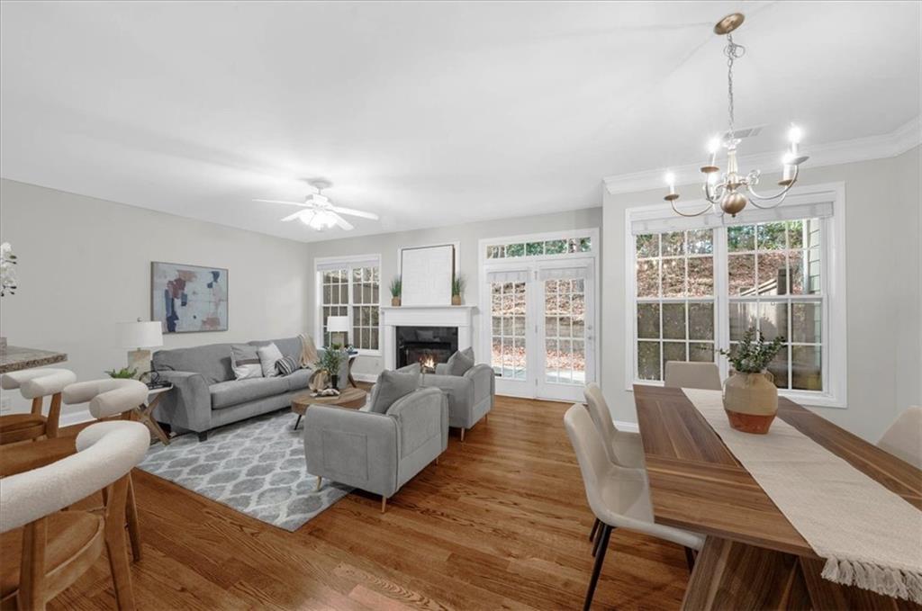 2426 Strand Avenue Lawrenceville, GA 30043 - Photo 2 of 30 a living room with furniture and a chandelier