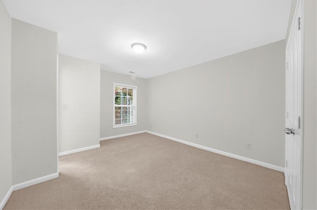 2426 Strand Avenue Lawrenceville, GA 30043 - Photo 21 of 30 a view of an empty room with a window