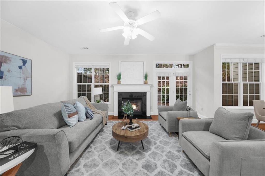 2426 Strand Avenue Lawrenceville, GA 30043 - Photo 6 of 30 a living room with furniture a window and a fireplace